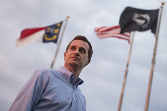 Image: Dan McCready, Democratic candidate for North Carolina's 9th District, talks with voters outside of the First United Methodist Church during his education tour in Pembroke, N.C.