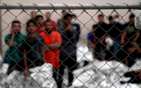 Image: Adult male detainees stand inside a holding area at the Border Patrol station in McAllen, Texas, on July 12, 2019.