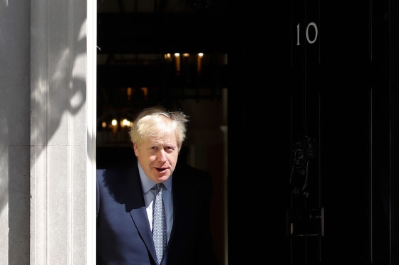 Image: Britain's Prime Minister Boris Johnson steps out of 10 Downing Street in central London.