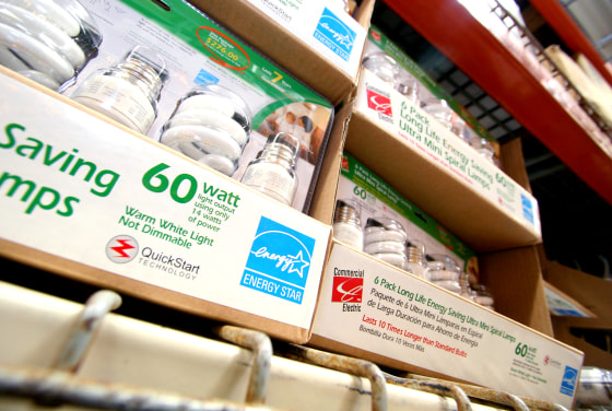 Rows of energy-efficient compact fluorescent light bulbs, marked with the blue energy star symbol, await shoppers at a Home Depot store Tuesday, Oct. 3, 2006, in Orlando, Fla.
