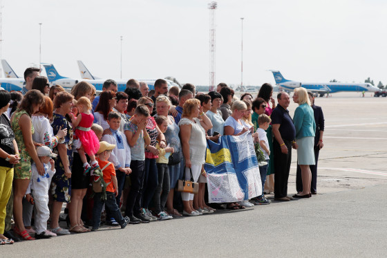 Relatives of Ukrainian prisoners wait to greet those freed at an airport in Kiev on Saturday.