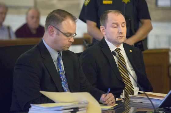 Former Scout leader Michael N. Kelsey, right, closes his eyes as his defense attorney Shane Hug takes notes at the St. Lawrence County Courthouse in Canton