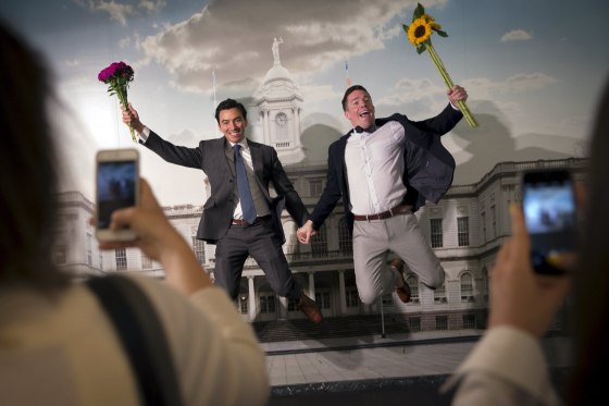 Image: Rodrigo Zamora and Ashby Hardesty pose together for friends at the New York City clerks office after their wedding in Manhattan in New York