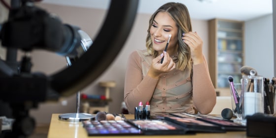 Vlogger reviewing make up products