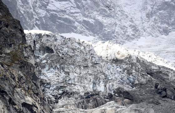 Image: A helicopter flies over part of the Planpincieux glacier in the Mont Blanc massif area of Italy on Sept. 25, 2019.