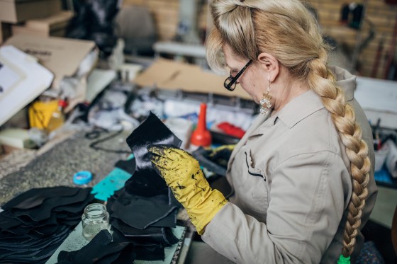 Mature woman working in shoe factory