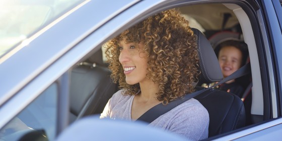 Woman in Car with Little Boy