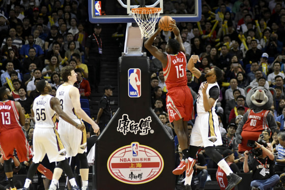 Image: New Orleans Pelicans players defend against Clint Capela of the Houston Rockets during an exhibition game in Shanghai in 2016.