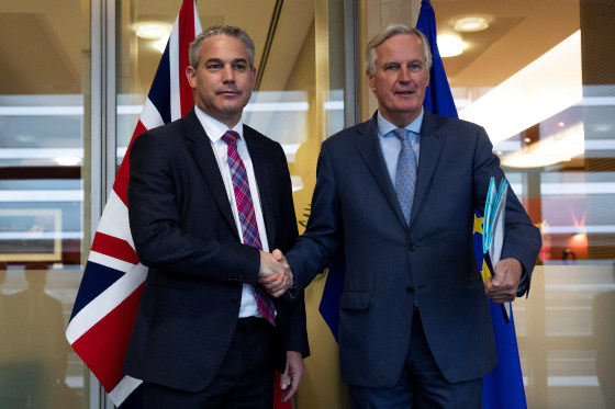 Britain's Brexit Secretary Barclay poses with EU's chief Brexit negotiator Barnier in Brussels