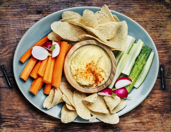 Hummus with vegetables and tortilla chips