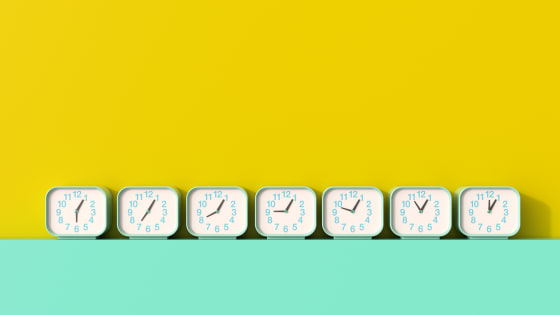 3D rendering, Row of alarm clocks, showing different times