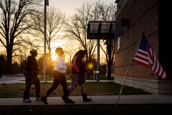Image: Women arrives to cast their ballots at an elementary school in Ferguson, Mo., on March 15, 2016.