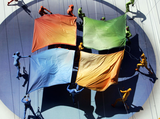 Image: A group of performers from the Grounded Aerial Dance Theater unfurl the Microsoft logo in New York