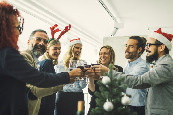 Image: Business people toasting with red wine at workplace