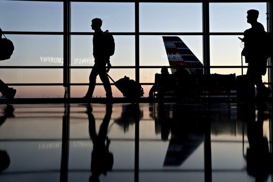Image: Travelers walk through Ronald Reagan National Airport in Washington on Nov. 21, 2018.