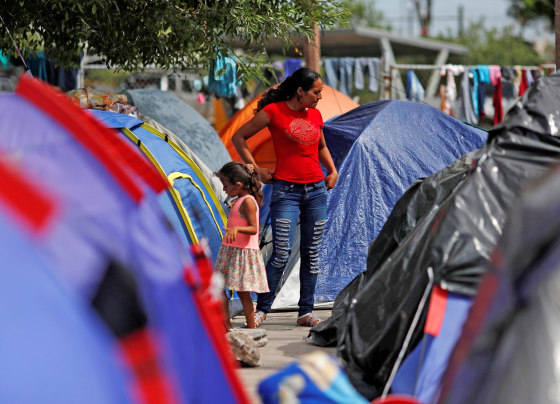 Image: FILE PHOTO: Central American migrants are seen outside their tents in an encampment in Matamoros