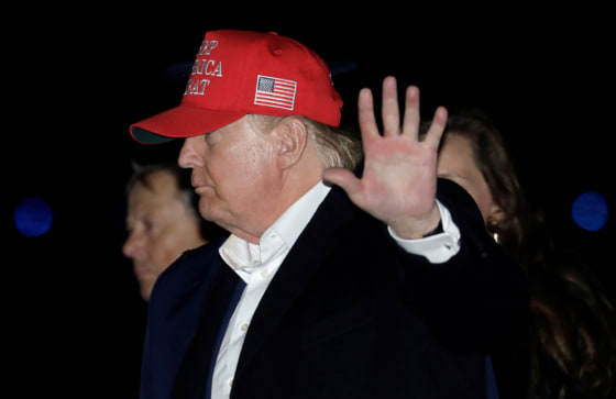 Image: President Donald Trump waves after disembarking Air Force One upon arriving in Joint Base Andrews, Maryland, U.S., after his Thanksgiving vacation