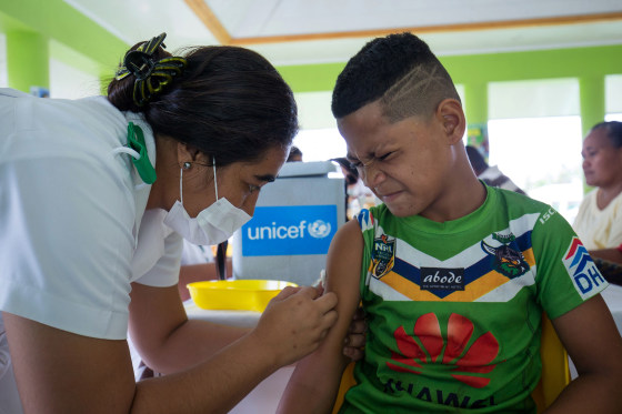 Image: A boy receiving a vaccine during a nationwide campaign against measles in the Samoan town of Le'auva'a