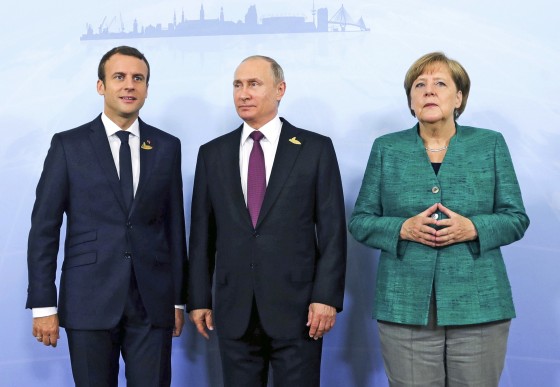 From left, French President Emmanuel Macron, Russia's President Vladimir Putin and German Chancellor Angela Merkel prior to a meeting during the G20 summit on July 8, 2017.