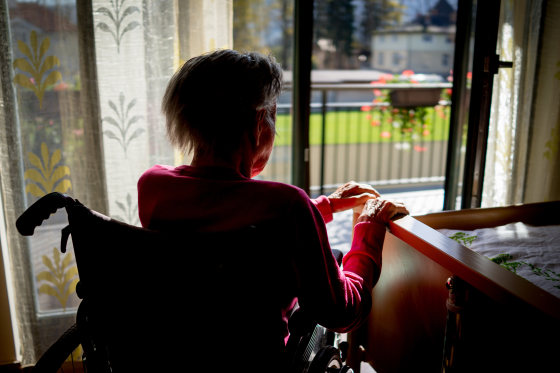 Senior woman in wheelchair at home