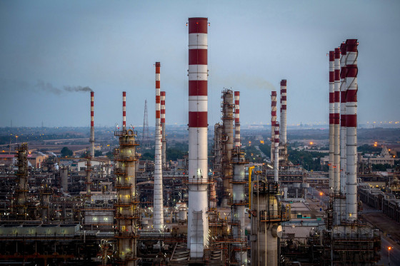 Image: Lights illuminate the processing plant at the Persian Gulf Star Co. (PGSPC) gas condensate refinery in Bandar Abbas