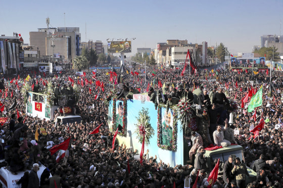 Image: The coffin of Gen. Qassem Soleimani is carried on a truck surrounded by mourners during a funeral procession in the city of Kerman, Iran