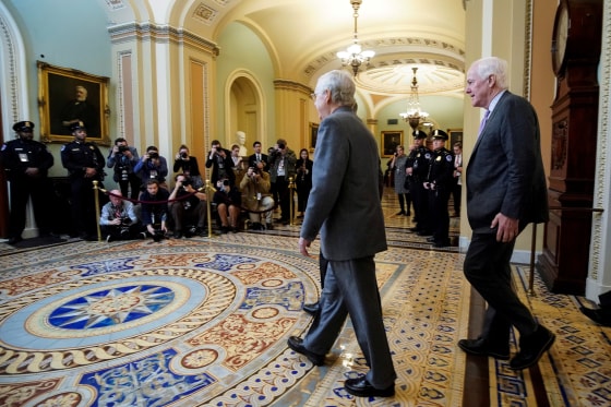 Image: FILE PHOTO: Senate Majority Leader McConnell and Senator Cornyn arrive for the beginning of the Trump impeachment trial in Washington