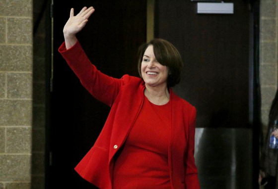 Image: Sen. Amy Klobuchar, D-Minn., waves as she arrives to speak to the Scott County Iowa Democrats on Jan. 25, 2020.