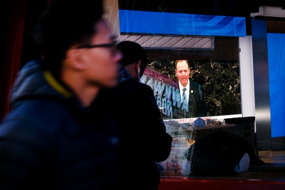 Image: House impeachment manager Rep. Adam Schiff speaks at the Senate impeachment trial of President Donald Trump on a television screen in New York Jan. 22, 2020.