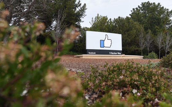 Image: A sign is seen at the entrance to Facebook's corporate headquarters