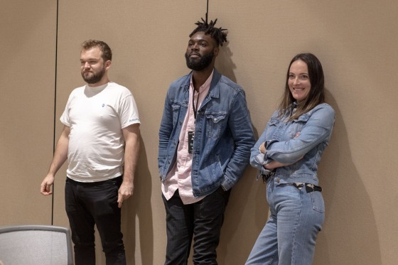 Godfre Bayalama, center, takes part in a workshop at the Arena Conference in Phoenix.