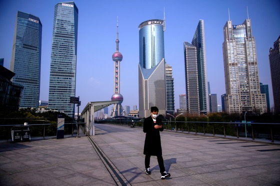 Image: A man wearing a protective mask walks through the financial district in Pudong, China, on Feb. 3, 2020.