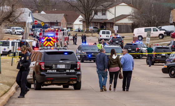 Emergency crews respond at the scene where a vehicle hit several Moore High School students in Moore, Okla., on Feb. 3, 2020.