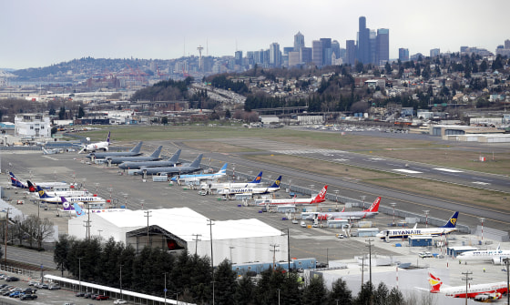 Airplanes at a Boeing facility at King County International Airport, also known as Boeing Field, with downtown Seattle in the background in February 2018.