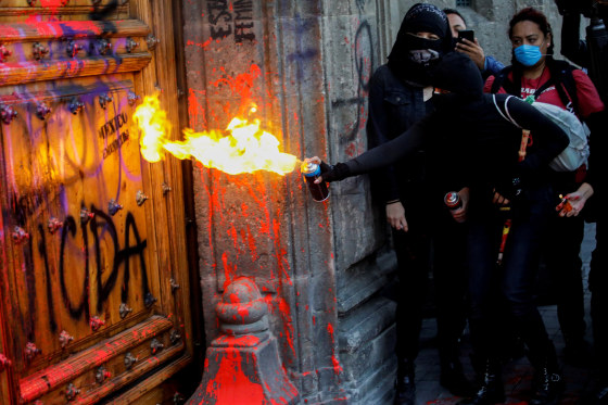 Image: People take part in a protest against gender-based violence in downtown of Mexico City