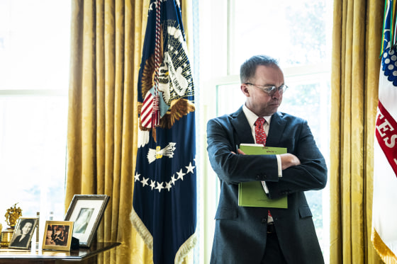 Image: Acting White House Chief of Staff Mick Mulvaney listens in the Oval Office on March 19, 2019.