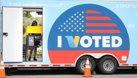 Image: A voter prepares her ballot during early Democratic primary voting in Universal City, Calif.