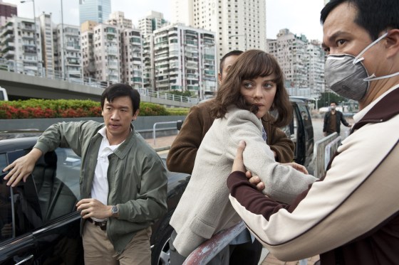 Chin Han, left, as Sun Feng and Marion Cotilard as Dr. Leonora Orantes in "Contagion."