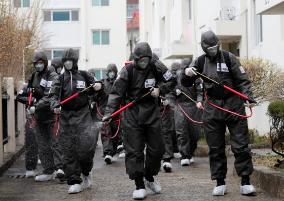 Image: South Korean soldiers spray disinfectants inside an apartment complex which is under cohort isolation after mass infection of coronavirus disease (COVID-19) in Daegu