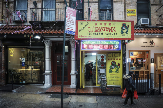 Image: A woman walks by Chinatown Ice Cream Factory