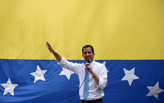 Image: Venezuelan opposition leader Juan Guaido addresses supporters during a street meeting within a demonstration heading to the National Assembly, in Las Mercedes, east Caracas
