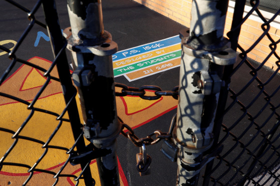 Image: A fence is locked outside the playground at P.S. 156 and L.S. 392, as the New York City school system canceled classes after further cases of coronavirus were confirmed in New York, in the Brownsville section of the Brooklyn borough of New York