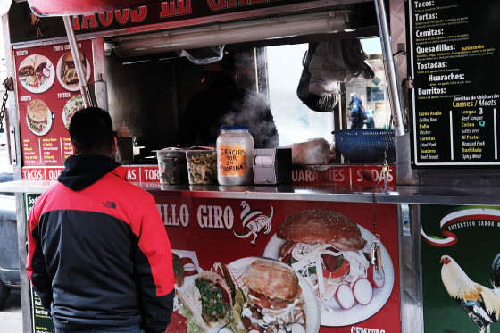 A food cart selling traditional Mexican food in the Jackson Heights neighborhood of New York