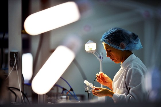 Image: An employee works on protective masks and parts for ventilators at a factory near Minsk, Belarus, on March 24, 2020.