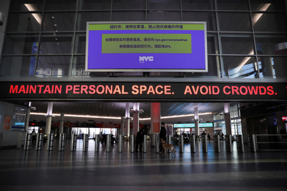 Image: A warning sign at Whitehall Terminal warns ferry riders to practice social distancing while commuting during the outbreak of the coronavirus disease (COVID-19) in Manhattan, New York City