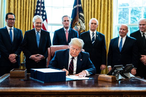 Image: President Trump Signs Coronavirus Stimulus Bill In The Oval Office