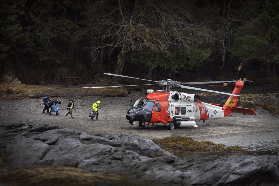 Image: A U.S. Coast Guard helicopter waits to airlift Ketchikan Volunteer Rescue personnel to search for Jaxson Brown, a missing 5-year-old-boy, in Alaska on March 28, 2020.