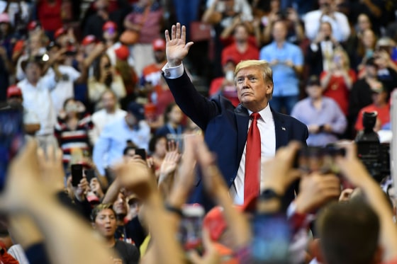 Image: President Donald Trump waves to supporters during a \"Keep America Great\" campaign rally in Sunrise