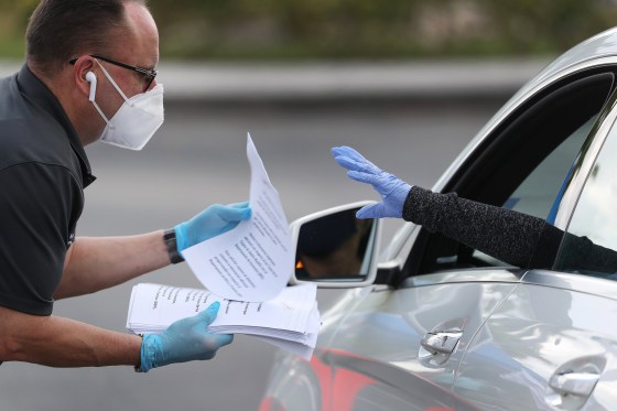 Image: People Line Up For Unemployment Applications In Hialeah, FL During COVID-19 Crisis