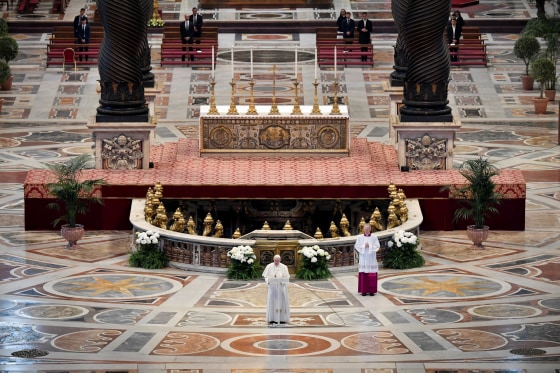 Image: Pope Francis reads his Easter message during mass at St. Peter's Basilica on April 12, 2020.